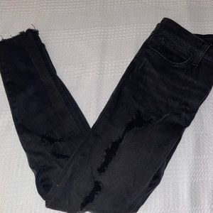 Distress black skinny jeans